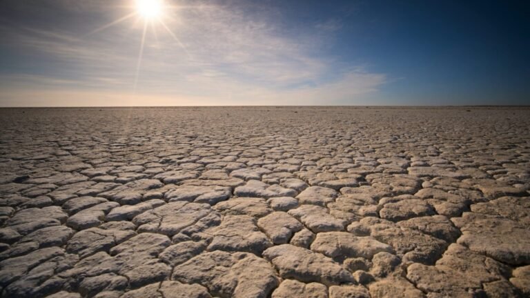 the sun is shining over a vast expanse of land