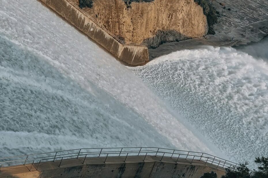 a large waterfall with water coming out of it